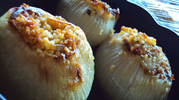 Traditional Greek stuffed onions from Samos with lemon sauce, served warm in a plate