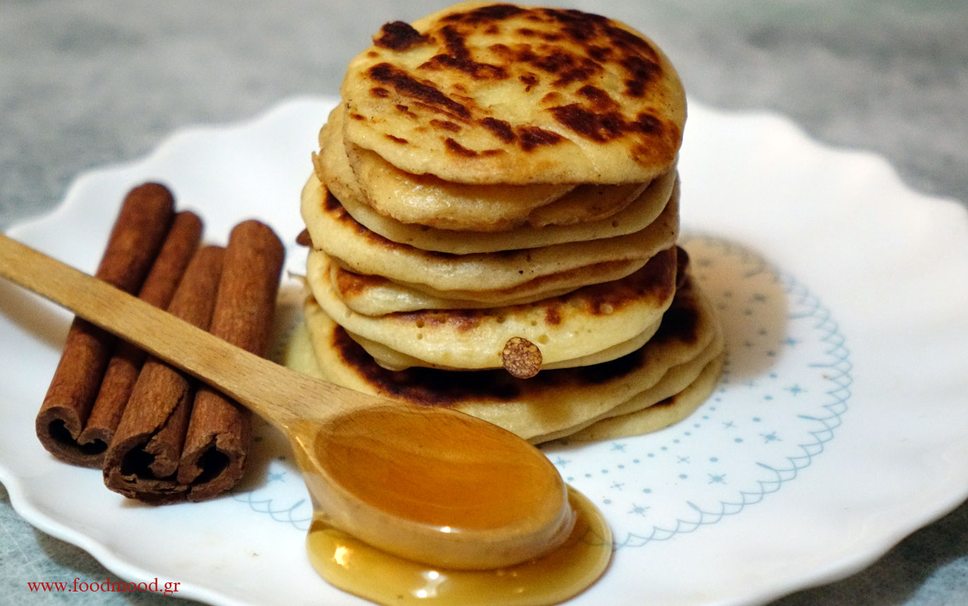Samos fritters topped with honey and crushed walnuts