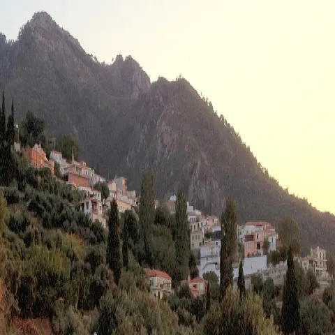 Panoramic view of Ambelos village in Samos with traditional houses and greenery.
